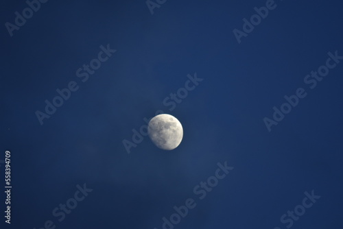 Moon at night with dark blue sky background