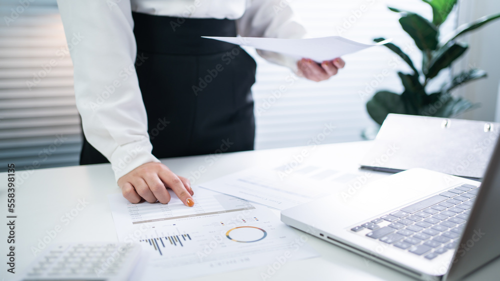 Auditor or internal revenue service staff, Business women checking annual financial statements of company. Audit Concept Auditor or internal revenue service staff, Business women checking annual financial statements of company. Audit Concept
