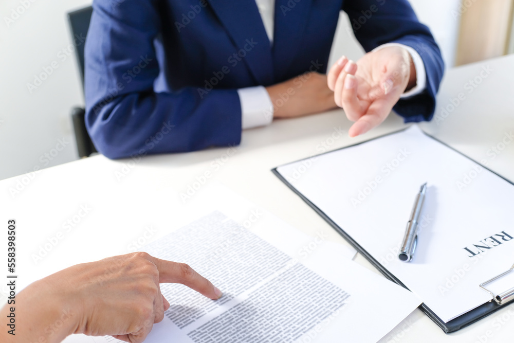 Sales manager giving advice application form document, considering mortgage loan offer for car and house insurance. Sales manager giving advice application form document, considering mortgage loan offer for car and house insurance.