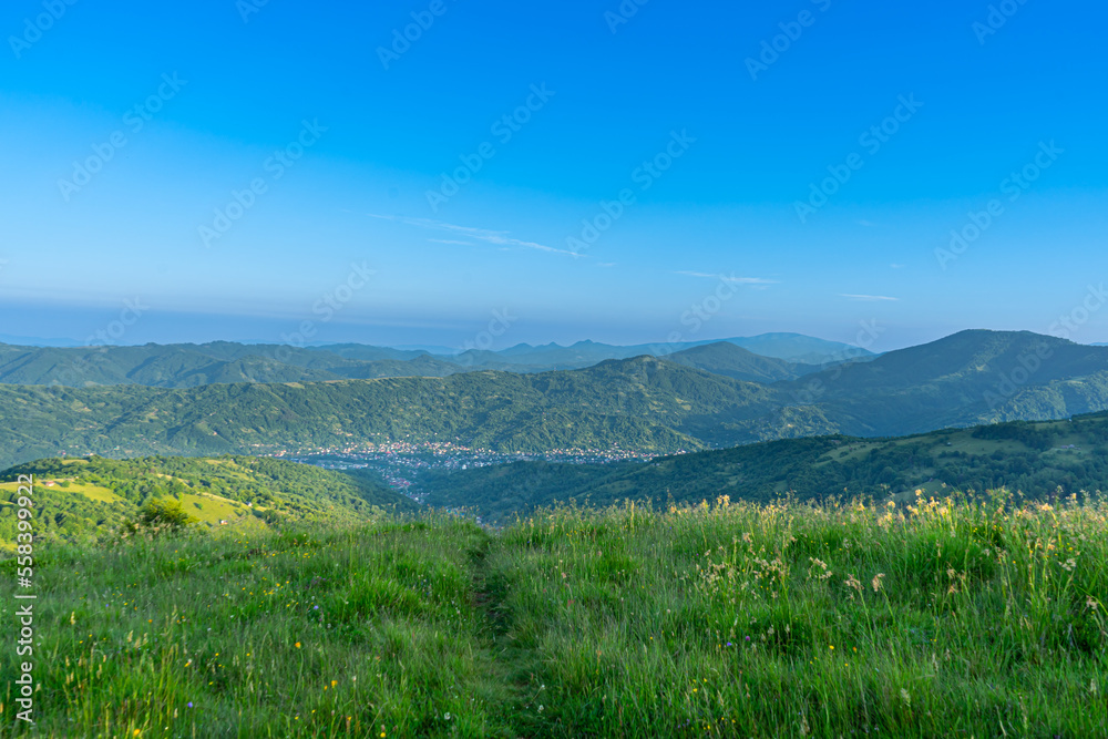 Sunrise over River Teresva and Dubove village from Apetska mountain, Carpathians mountains, Ukraine.