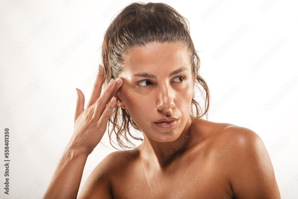 Looking away while touching her skin Looking away while touching her skin