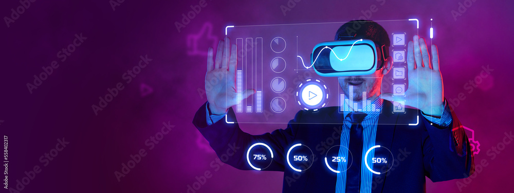 Young businessman in suit wearing VR glasses on his head touch virtual screen over purple background in neon light. Business, NFT token digital crypto art blockchain technology concept. Young businessman in suit wearing VR glasses on his head touch virtual screen over purple background in neon light. Business, NFT token digital crypto art blockchain technology concept.