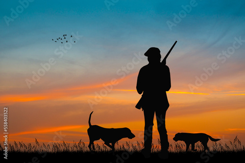 silhouette of hunters at sunset