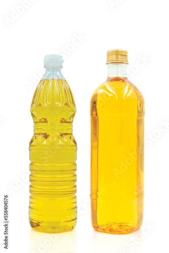 Vegetable oil cooking in plastic clear bottle with lid isolated on white background.