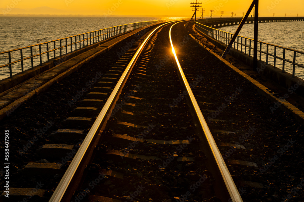 Fototapeta premium Railroad at sunset. Industrial concept background. Transportation