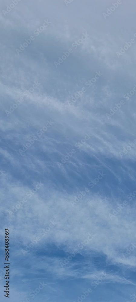 White cirrus clouds on blue sky background. Summer cloudy day backdrop with copy space. winter peaceful sky.
White cirrus clouds on blue sky background. Summer cloudy day backdrop with copy space. winter peaceful sky.