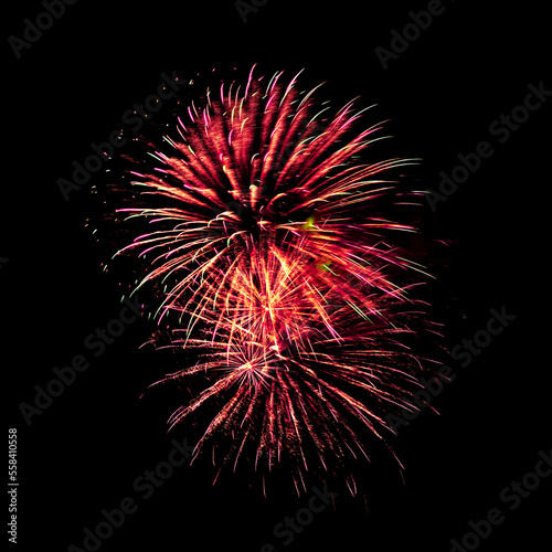 Fotografie Colorful celebration fireworks isolated on black sky background.