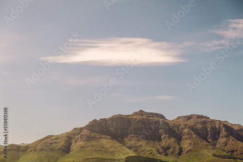 Mountainside with Clouds above