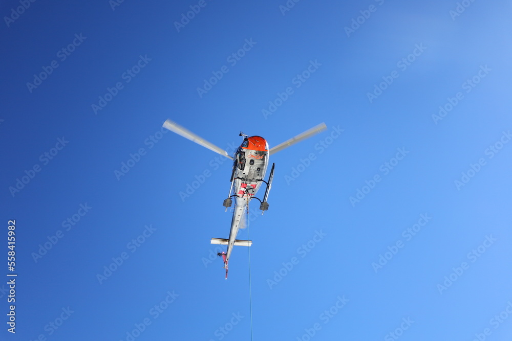 View on a helicopter in the Aiguille du Midi which is a 3,842-metre-tall mountain in the Mont Blanc massif within the French Alps View on a helicopter in the Aiguille du Midi which is a 3,842-metre-tall mountain in the Mont Blanc massif within the French Alps