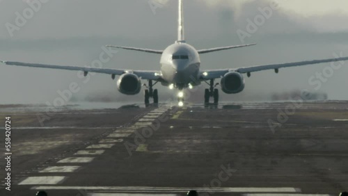 Camera Tilting To Follow Plane Take-Off With Landing Gear Retraction photo