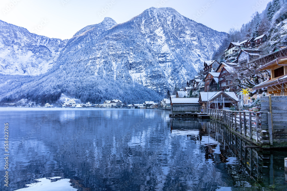 beautiful cityscape of the special city Hallstatt in Austria Salzkammergut snowy winter mountains and lake and wooden details