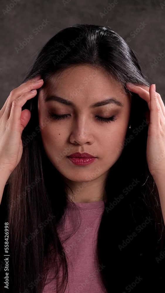 Young woman suffers from headache - studio shooting Young woman suffers from headache - studio shooting