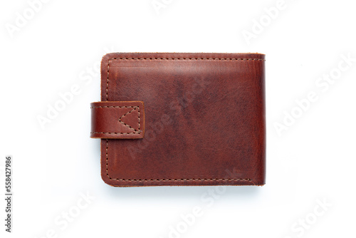Brown leather wallet on a button on a white background. Top view.