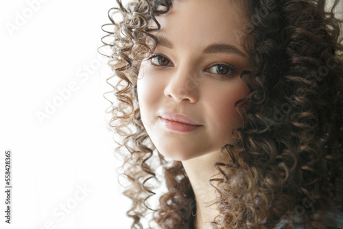Portrait of a beautiful girl with gorgeous curls.