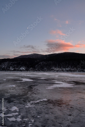 crystal clear frozen ice in winter