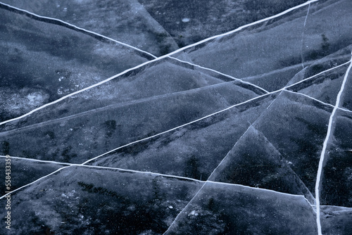 crystal clear frozen ice in winter