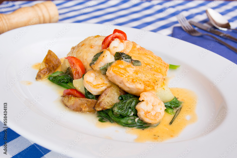 Monkfish with prawns and vegetables in a Spanish restaurant.