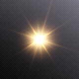 The effect of bright sunlight. Twinkling gold star on a transparent background.Bright light effect.