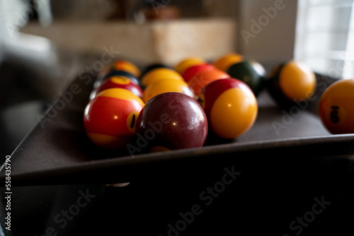 pool balls in wooden tray