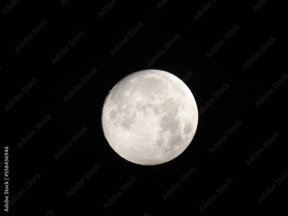 Telescopic view of a full moon. Full moon shot showing details of the moon s surface. Telescopic view of a full moon. Full moon shot showing details of the moon s surface.