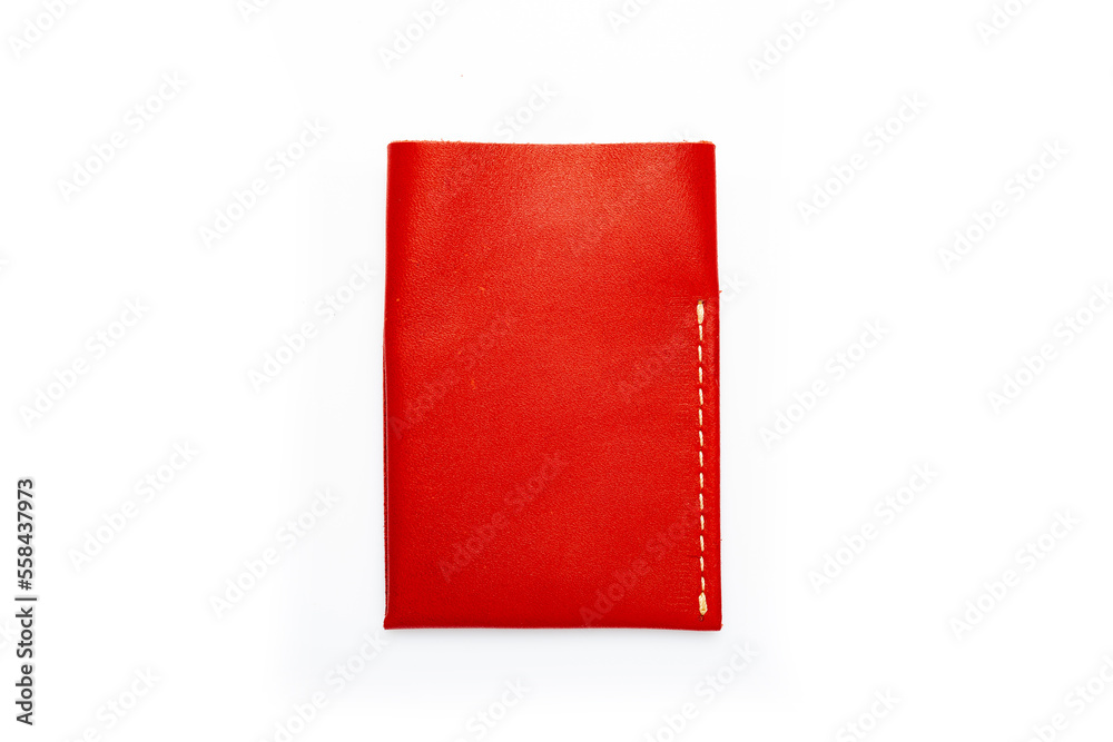 Red leather wallet on a button on a white background. Card holder. Top view Red leather wallet on a button on a white background. Card holder. Top view