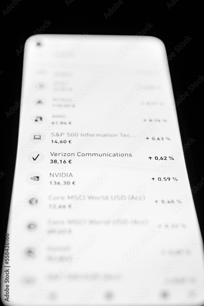 Obraz premium Stock market shares on cellphone screen. Broker application to invest in the stock market. Stock market action. Stock market graph on a screen. Real-time variations of prices and shares. 