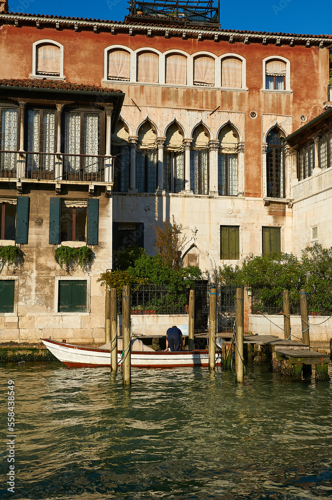 Facade of a typical Venetian house with a pier at the door