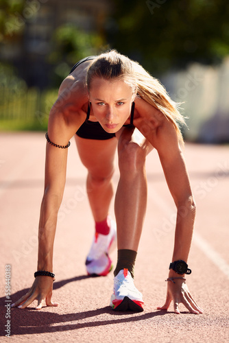 Woman getting ready to start on Stadium - summer outdoors training.