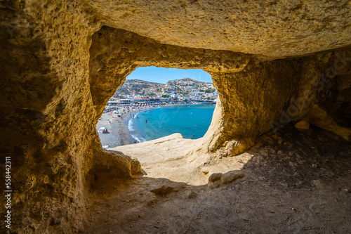 Famous Matala beach with caves, known for hippies in the 70's. photo