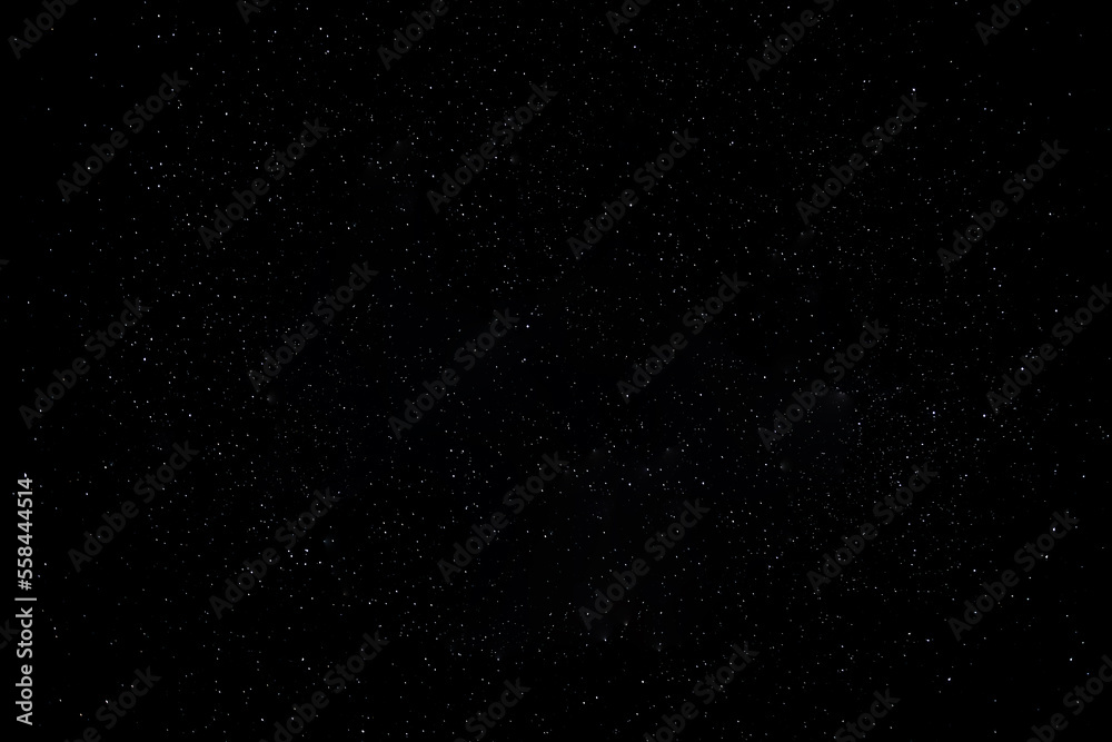 Starry night sky as a background full of small white stars
