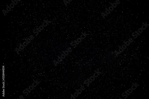 Starry night sky as a background full of small white stars