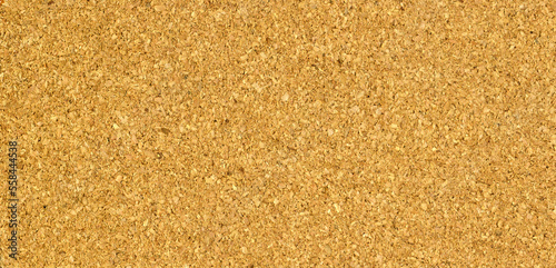 Board made of granulated cork as an abstract background. Web-banner with copy space