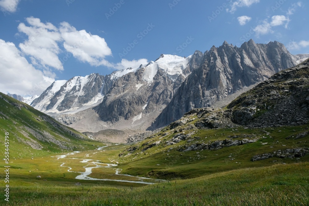Scenery of Tian Shan Mountains during trekking in Altyn Arashan Valley to beautiful glacier. Karakol national park. Kyrgyzstan, Central Asia