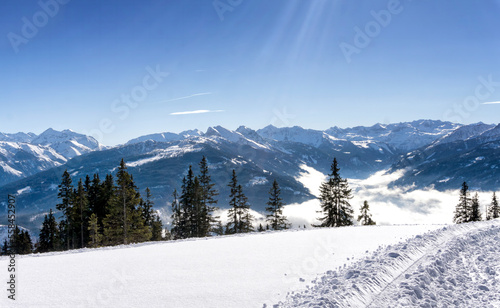 Scenic mountain panorama during wintertime in Salzburg Alps, Austria, Europe. View from Rossbrand mountain on valley and surrounding countryside. © msnobody