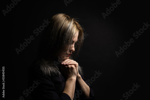 Woman hands praying to god. Woman Pray for god blessing to wishing have a better life. begging for forgiveness and believe in goodness. Christian life crisis prayer to god. © Angelov