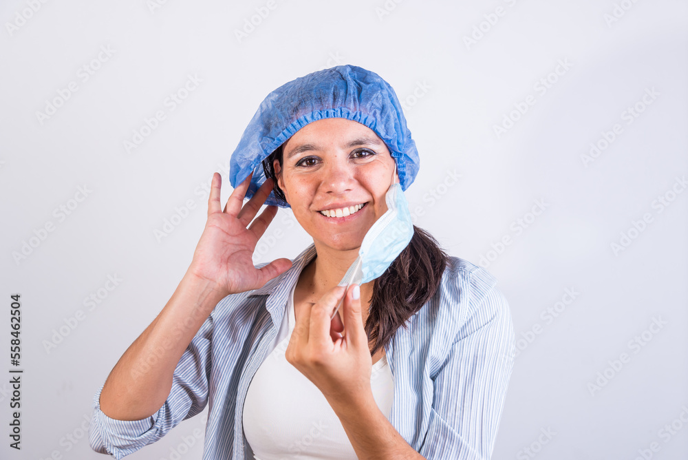 young Latin American doctor, smiling, wearing a cap and gown, doctors investigating an infection. young Latin American doctor, smiling, wearing a cap and gown, doctors investigating an infection.