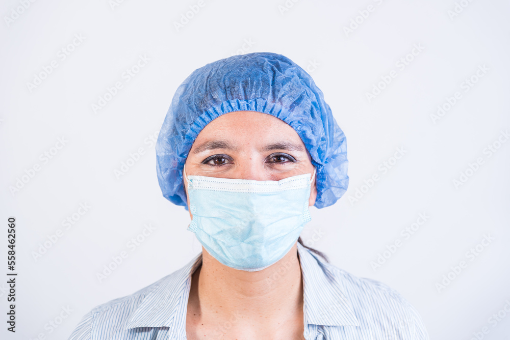 smiling doctor, with cap and mask, doctors investigating an infection. smiling doctor, with cap and mask, doctors investigating an infection.