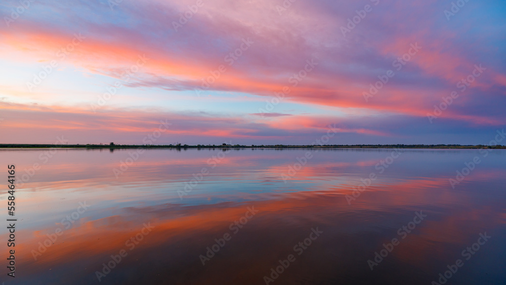 Sunrise with reflections in the Danube Delta in Romania Sunrise with reflections in the Danube Delta in Romania