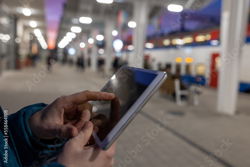 Wallpaper Mural Girl using tablet in front of train coming Torontodigital.ca