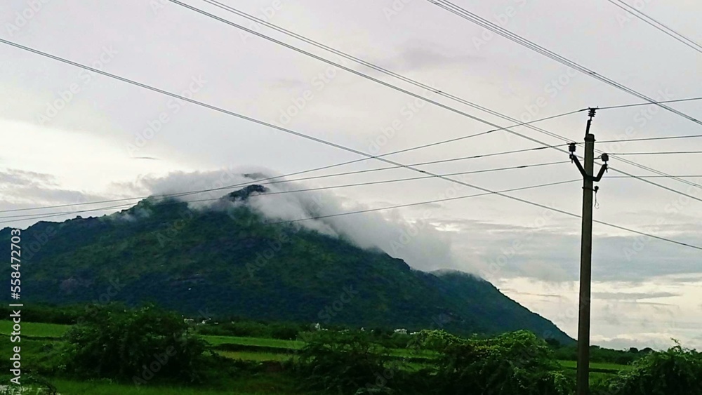 Clouds touch the hills in a monsoon climate
