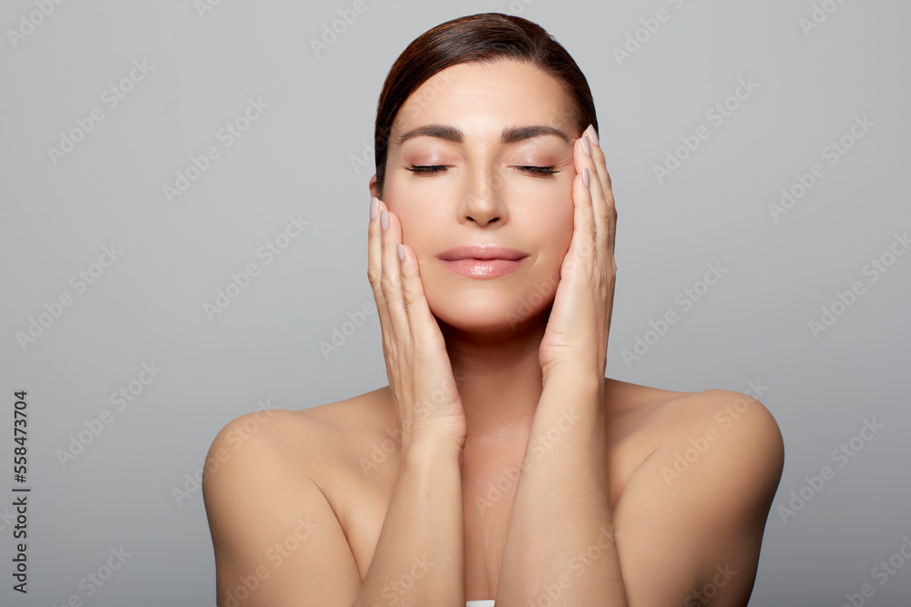 Beautiful middle-aged model in a skincare concep