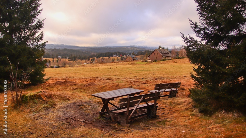 Fototapeta premium A sunrise above the cottages in meadows at Filipova Hut, Czech republic