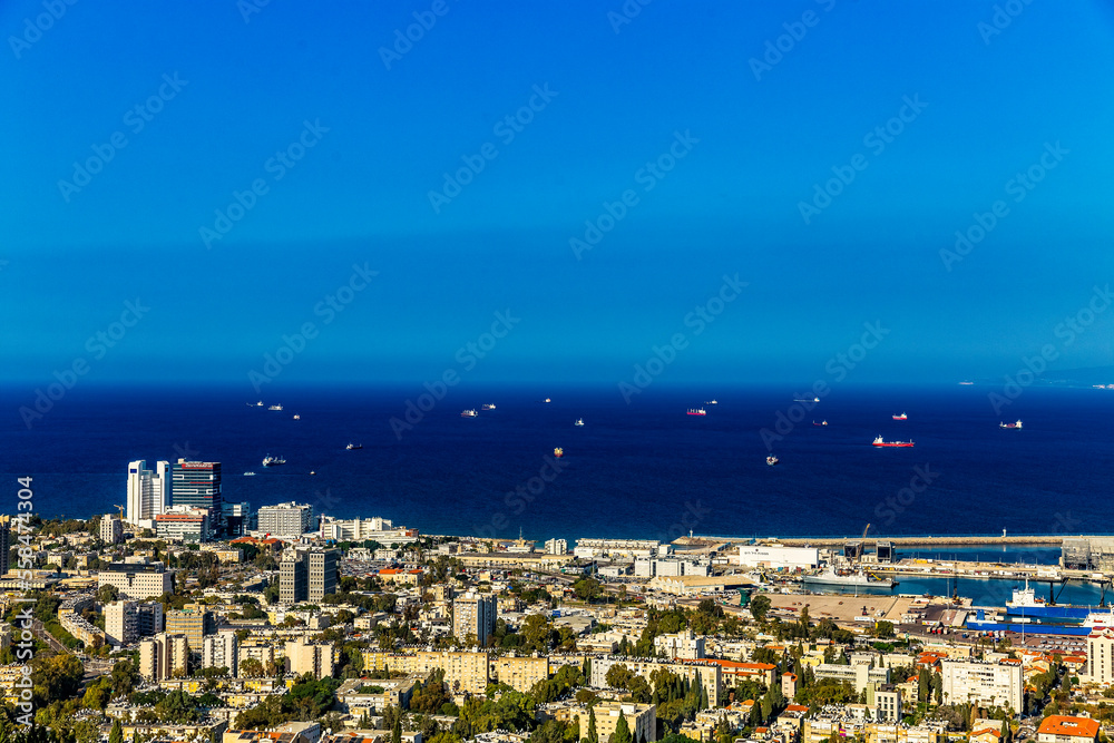 Panoramic view of the harbor port of Haifa and Rambam hospital with downtown Haifa, sea, the ships, the industrial zone in a sunny winter day. Haifa, Northern Israel