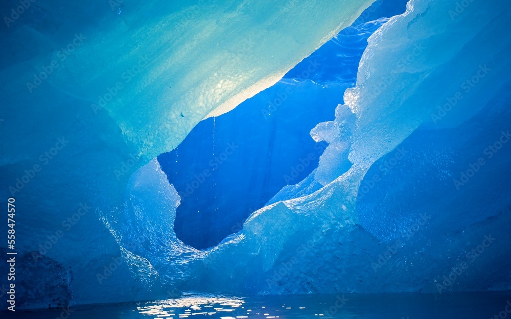 Detail of iceberg fragments floating in the atlantic ocean. Blue glacial ice in Iceland.