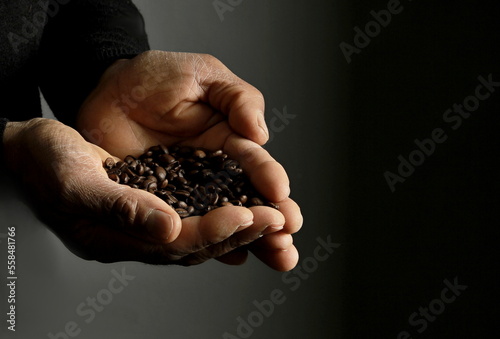 hand with coffee beans roasted with the smell of fresh coffee stock photo