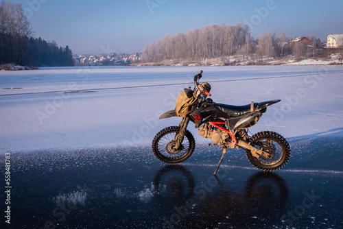 Fototapeta Naklejka Na Ścianę i Meble -  motocross on frozen lake	
