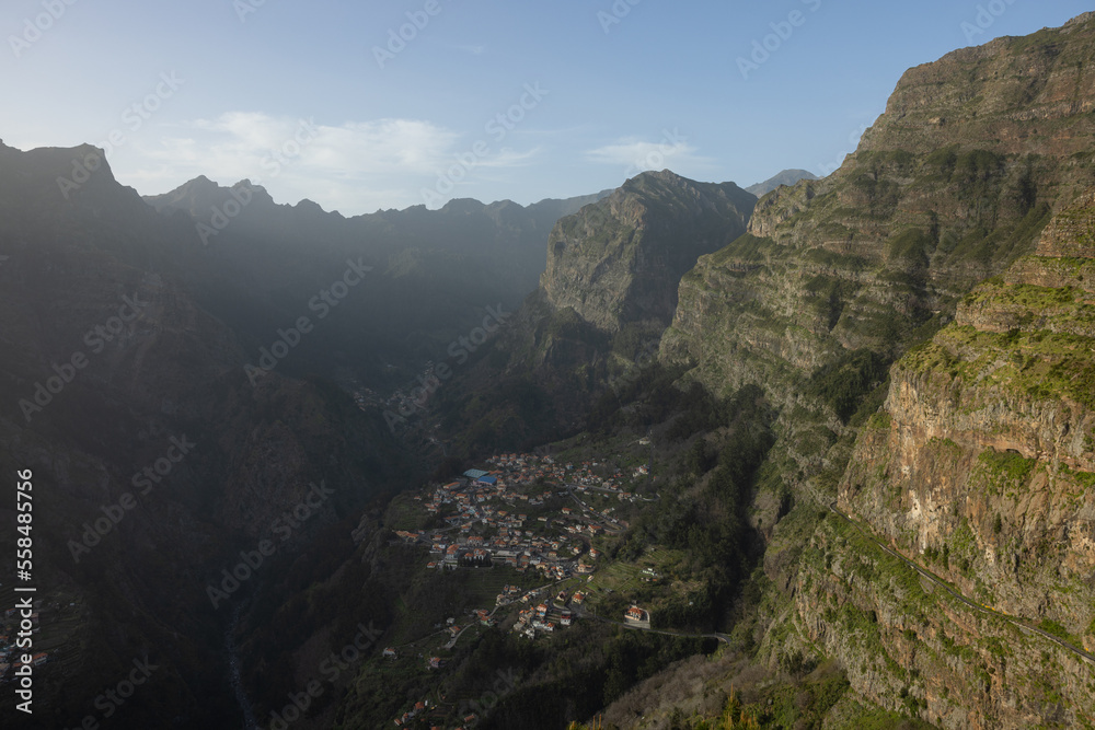 A very small village called Curral das Freiras in this canyon in Madeira on a beautiful sunset.