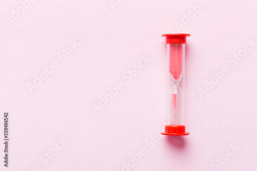 hourglass on the table, sand clock as time passing concept for business deadline, copy space