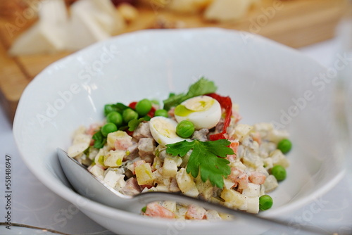 a plate with traditional Russian olivier salad. 