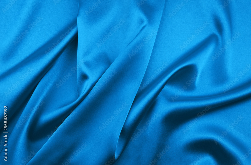 Blue satin or silk fabric as background Blue satin or silk fabric as background